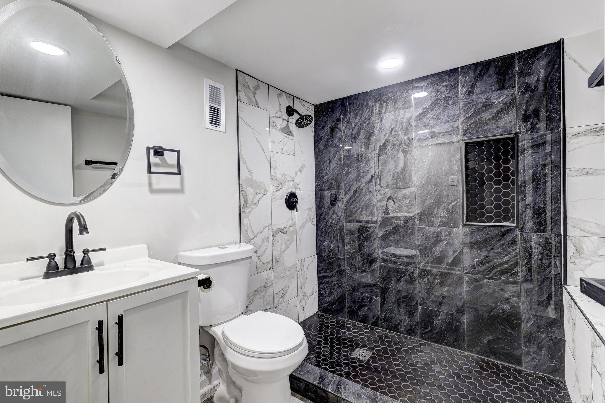 428 South Augusta Avenue Baltimore, MD 21229 - Photo 24 of 28 a bathroom with a sink toilet and shower