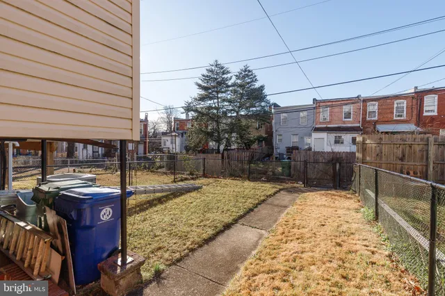 a view of a backyard with sitting area
