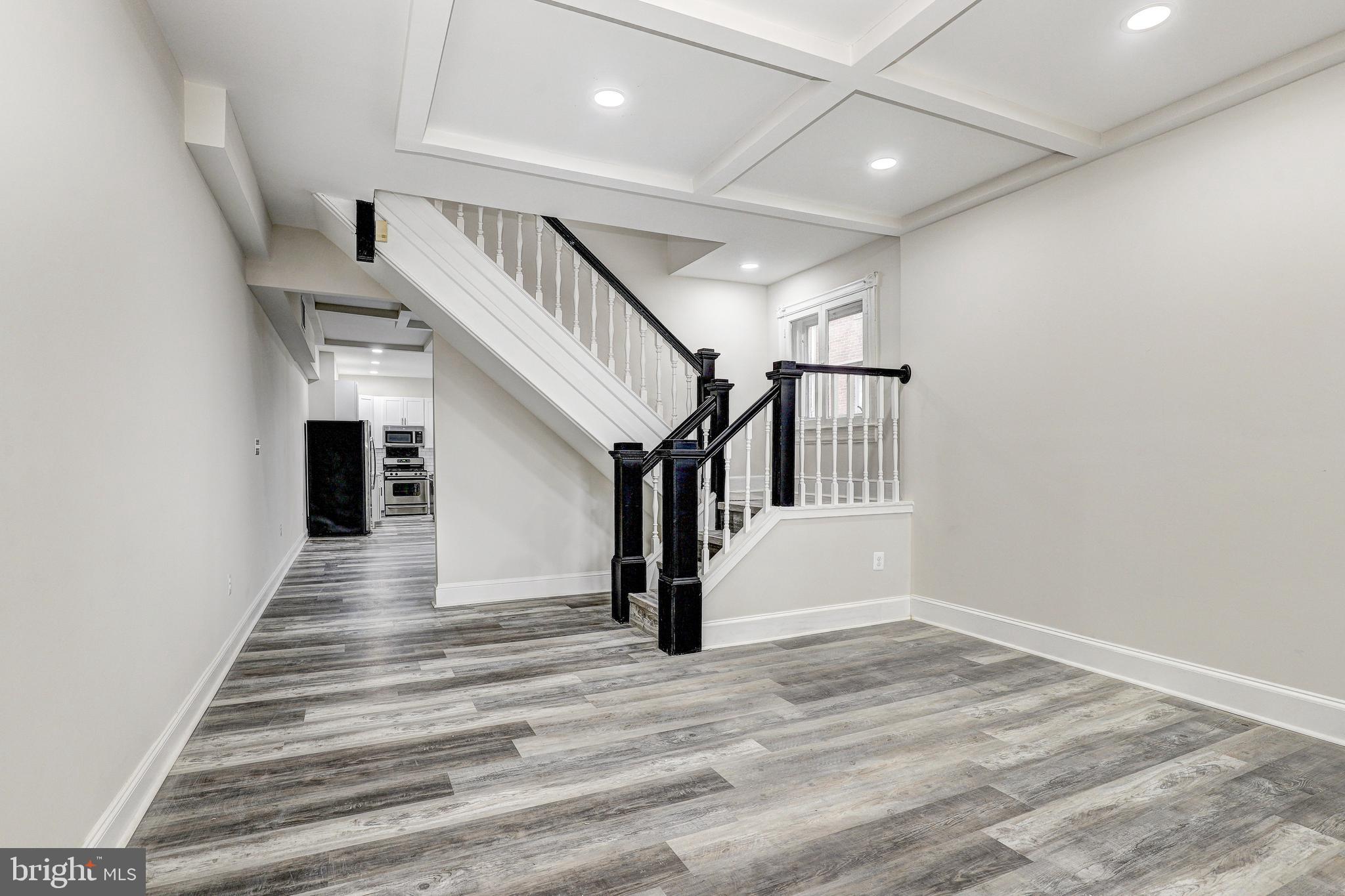 428 South Augusta Avenue Baltimore, MD 21229 - Photo 5 of 28 a view of entryway and hall with wooden floor