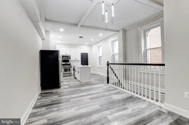 a view of a living room with a large window