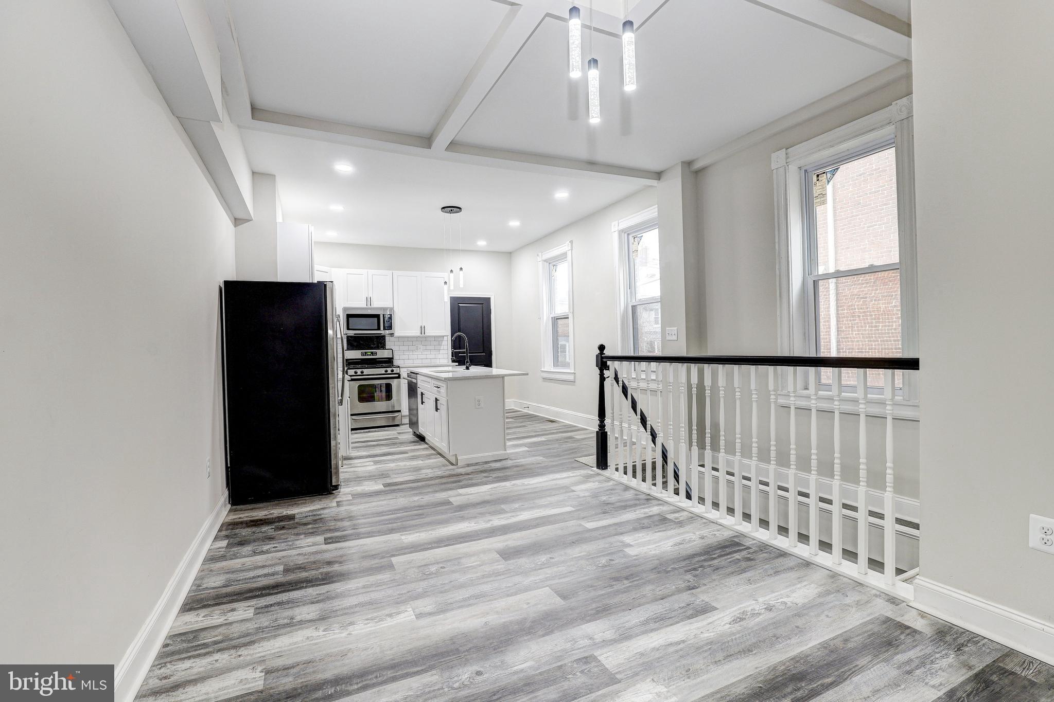 428 South Augusta Avenue Baltimore, MD 21229 - Photo 8 of 28 a view of a living room with a large window