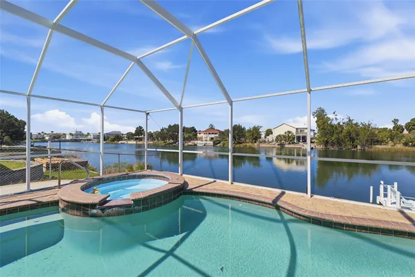an aerial view of a house with a swimming pool