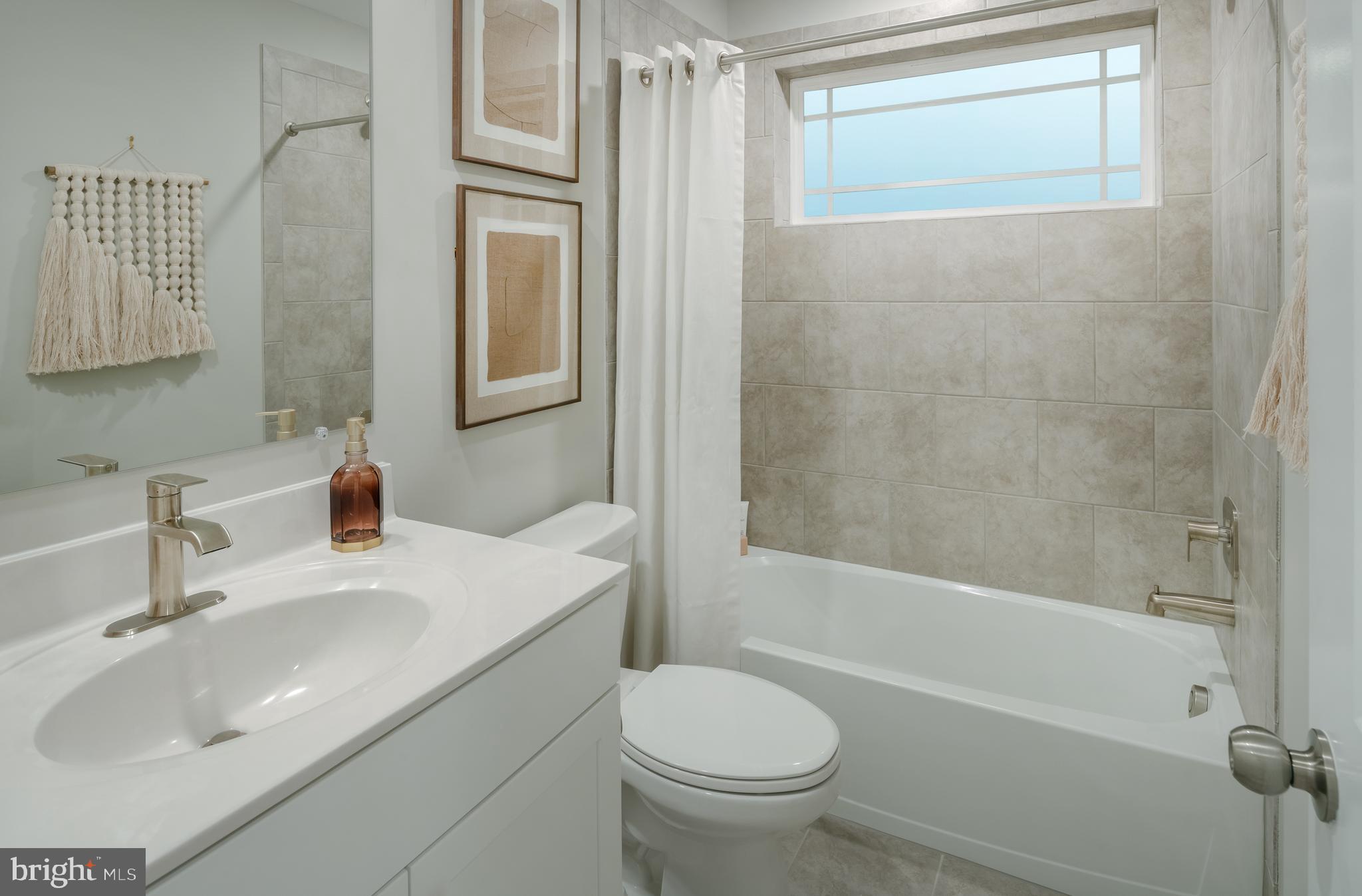 1801 Betterton Road Essex, MD 21221 - Photo 11 of 34 a bathroom with a sink toilet and shower