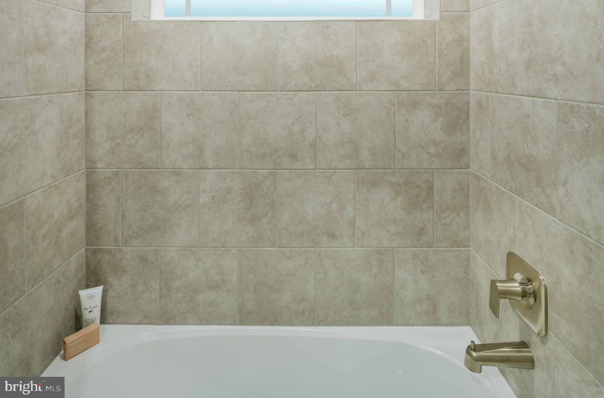 1801 Betterton Road Essex, MD 21221 - Photo 12 of 34 a bathroom with a bathtub