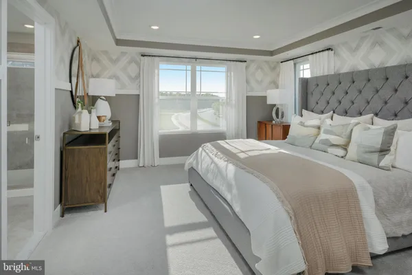 a bed room with a bed and a window