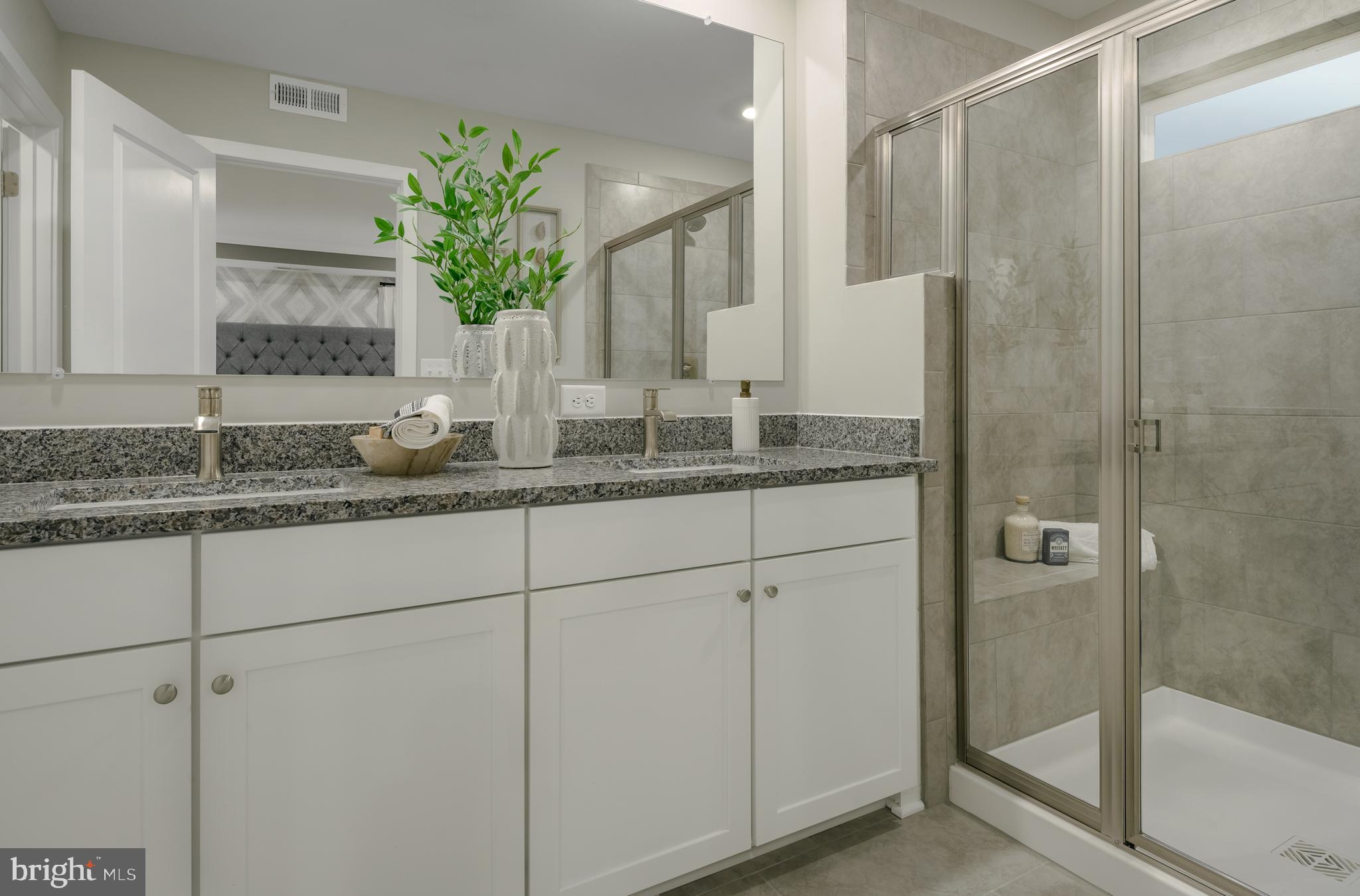 1801 Betterton Road Essex, MD 21221 - Photo 15 of 34 a bathroom with a granite countertop sink and a mirror
