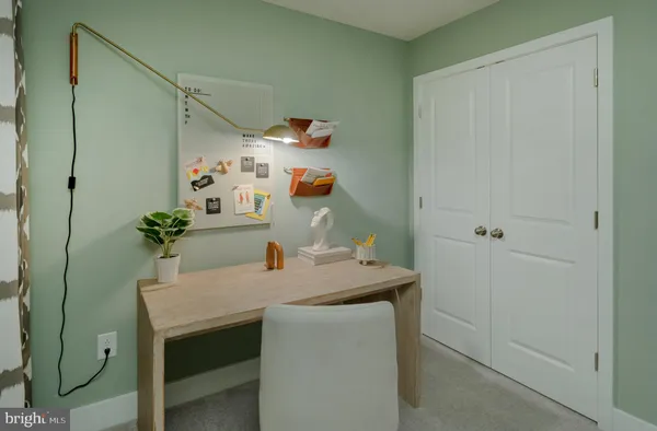 a dining room with a table and chairs