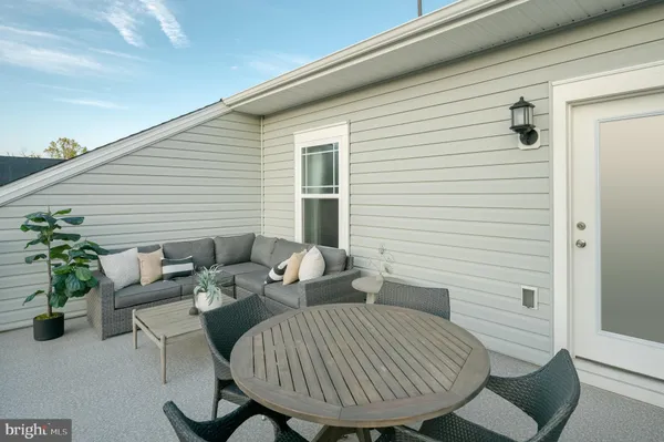 a view of a porch with furniture
