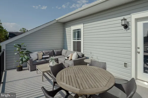 a view of a patio with couple of chairs