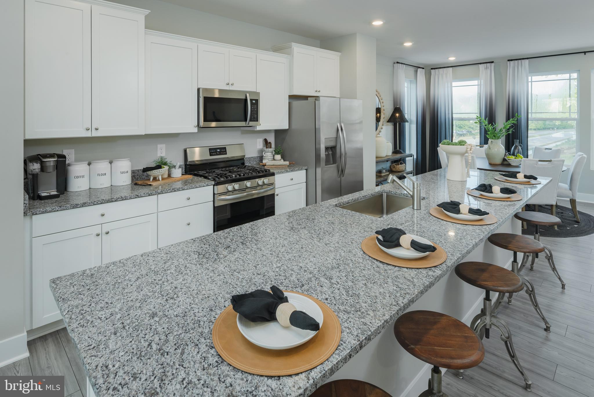 1801 Betterton Road Essex, MD 21221 - Photo 3 of 34 a kitchen with furniture and a refrigerator