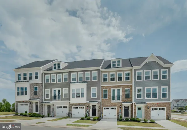 a front view of a building with lot of windows