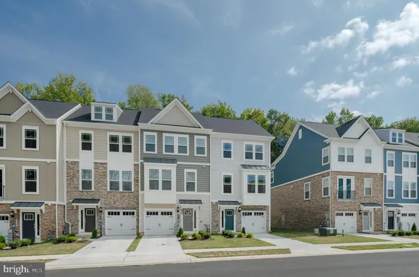 a view of a big house in a big yard with large windows
