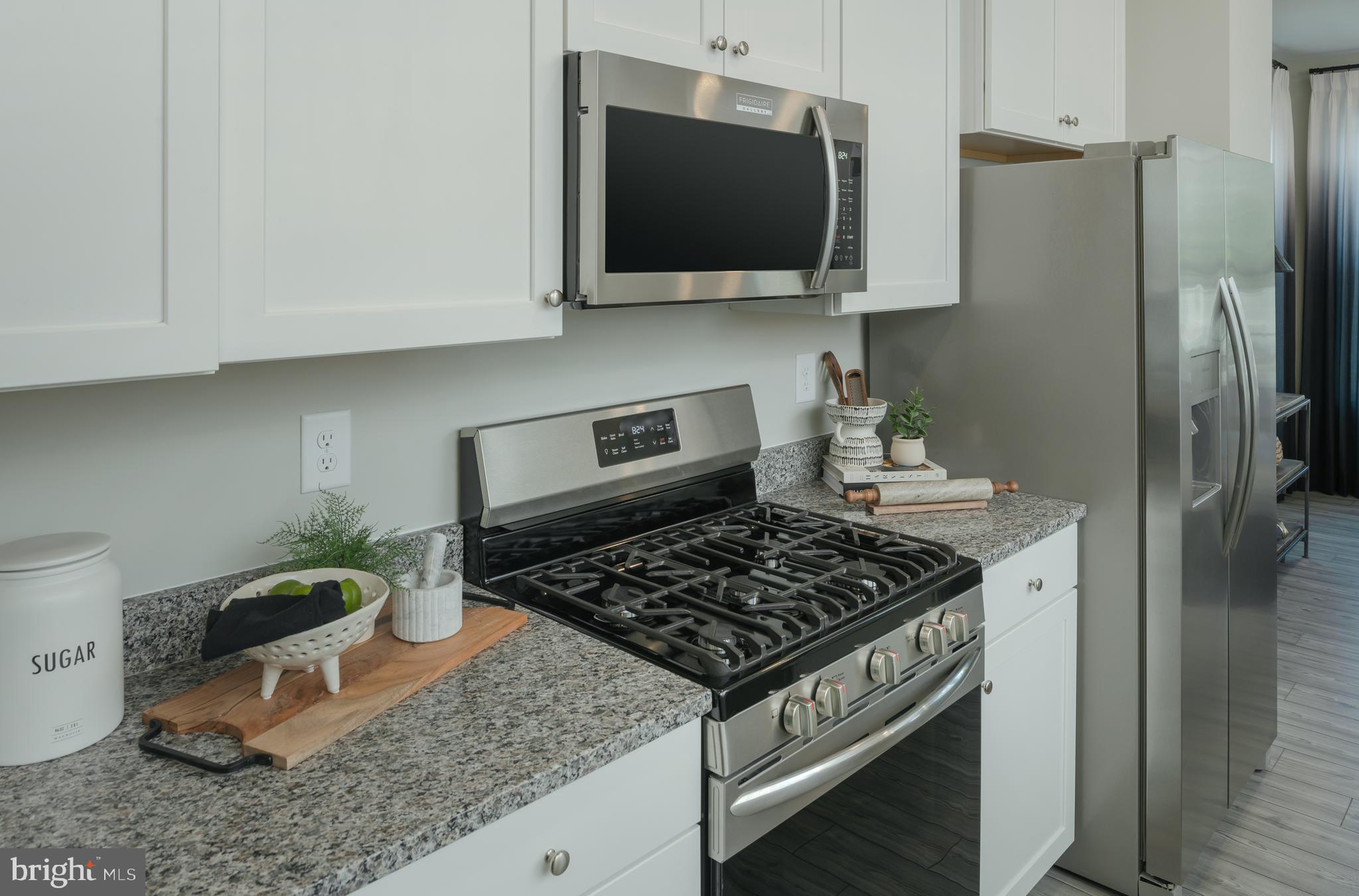 1801 Betterton Road Essex, MD 21221 - Photo 8 of 34 a kitchen with a stove and a microwave