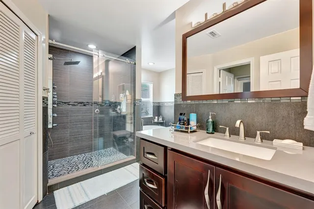 a bedroom with a bed and a desk