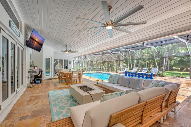 a view of a house with a lush green forest