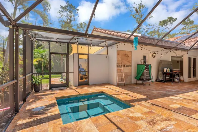 an aerial view of a house with outdoor space and street view