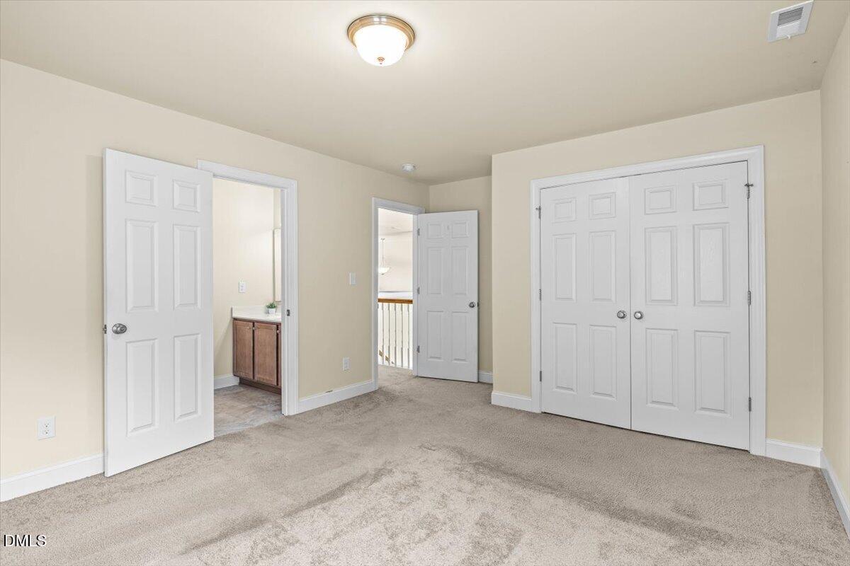 704 Haw River Hopedale Road Burlington, NC 27217 - Photo 31 of 49 an empty room with closet area