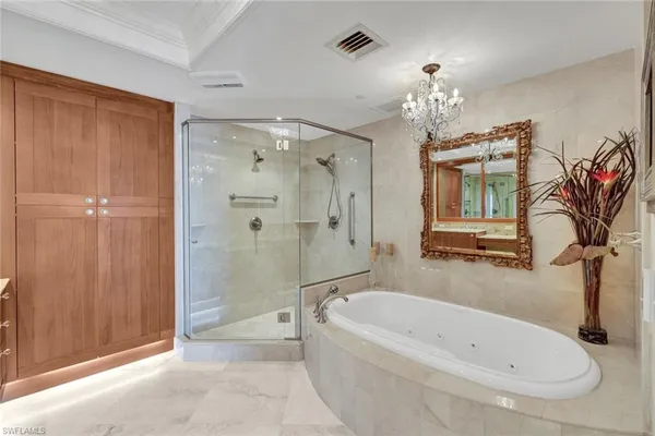a bathroom with a shower sink vanity mirror and toilet
