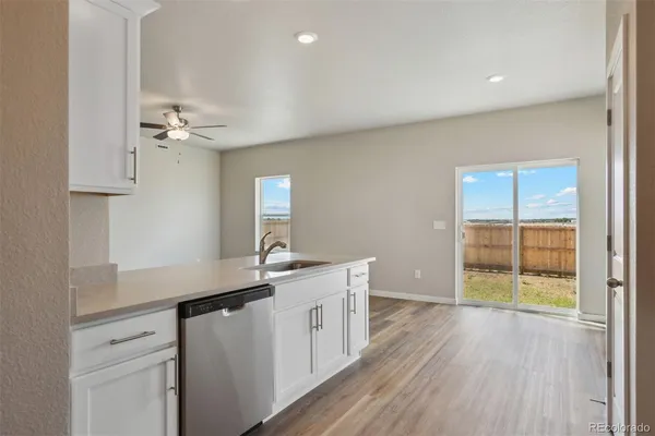 a kitchen with a sink and a window