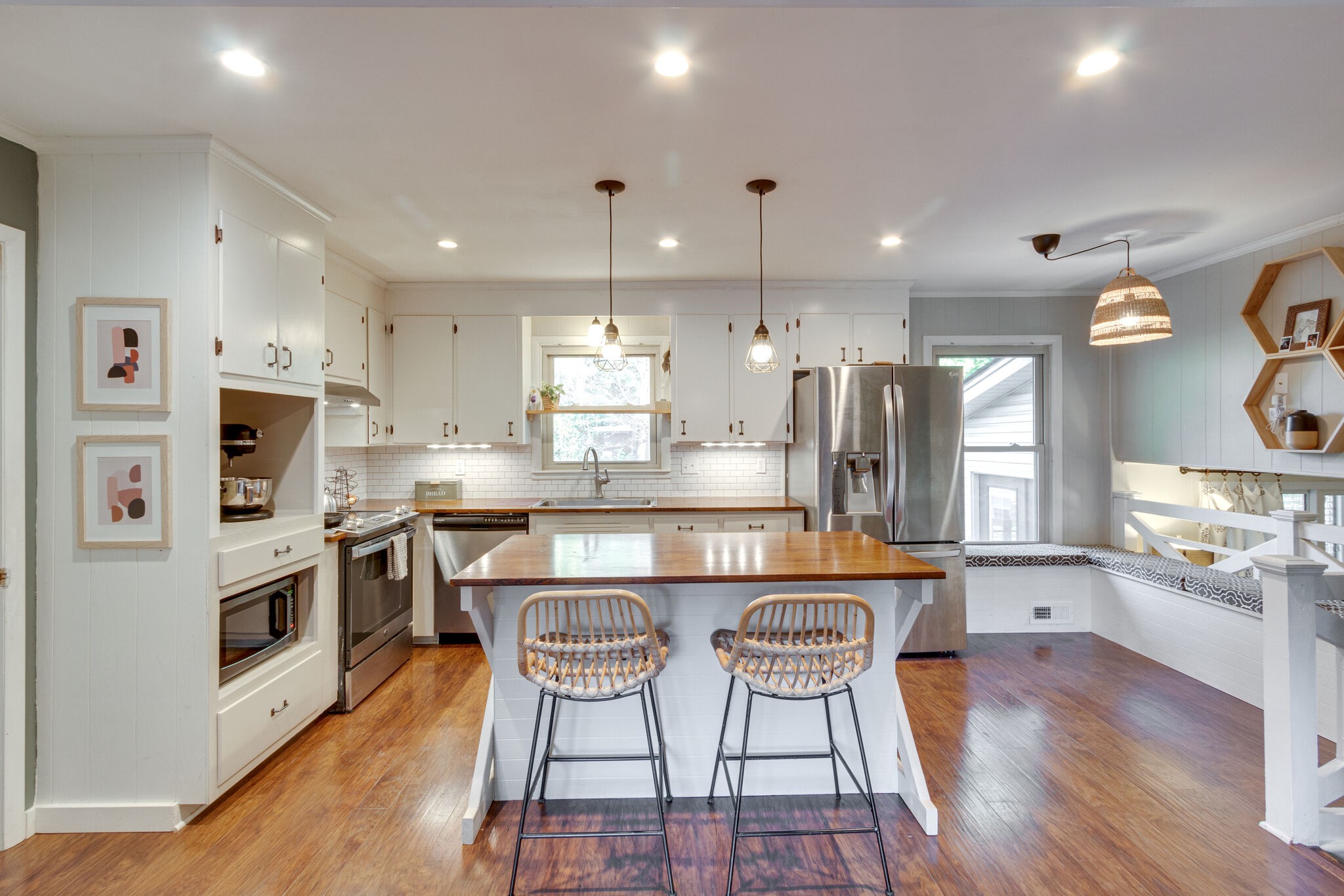 1202 Raleigh Court Murfreesboro, TN 37130 - Photo 11 of 34 a kitchen with stainless steel appliances a dining table chairs stove and refrigerator