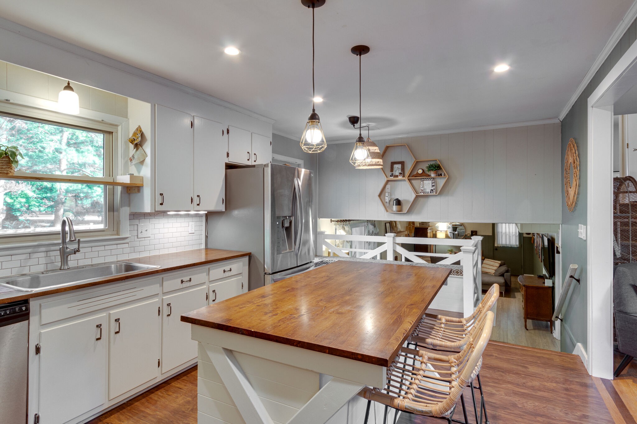 1202 Raleigh Court Murfreesboro, TN 37130 - Photo 13 of 34 a kitchen with refrigerator cabinets dining table and chairs