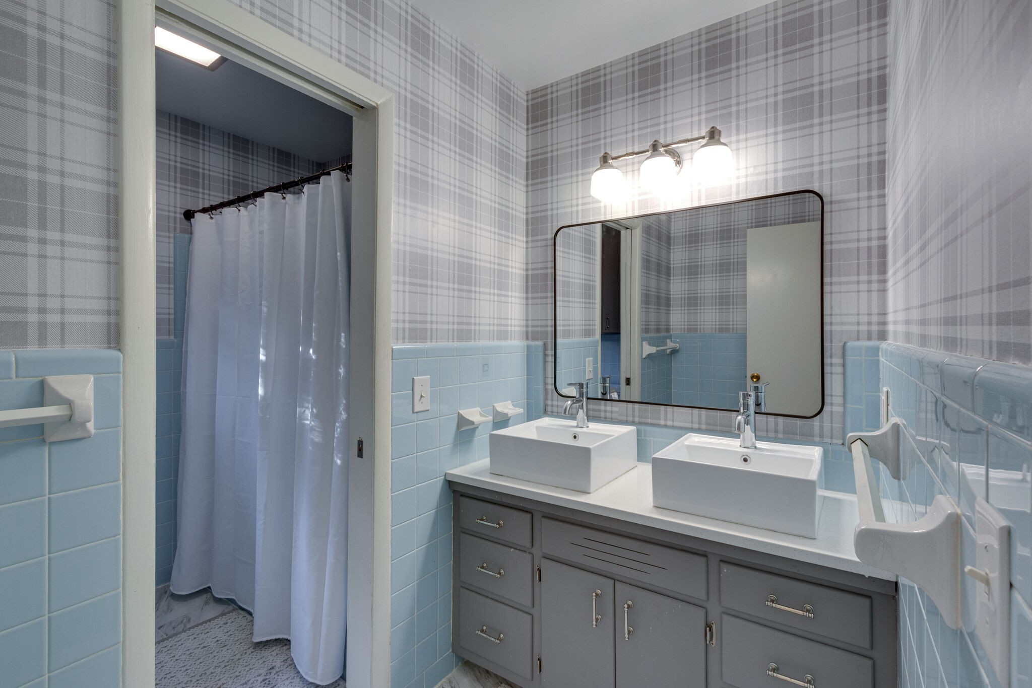 1202 Raleigh Court Murfreesboro, TN 37130 - Photo 29 of 34 a bathroom with a double vanity sink and mirror