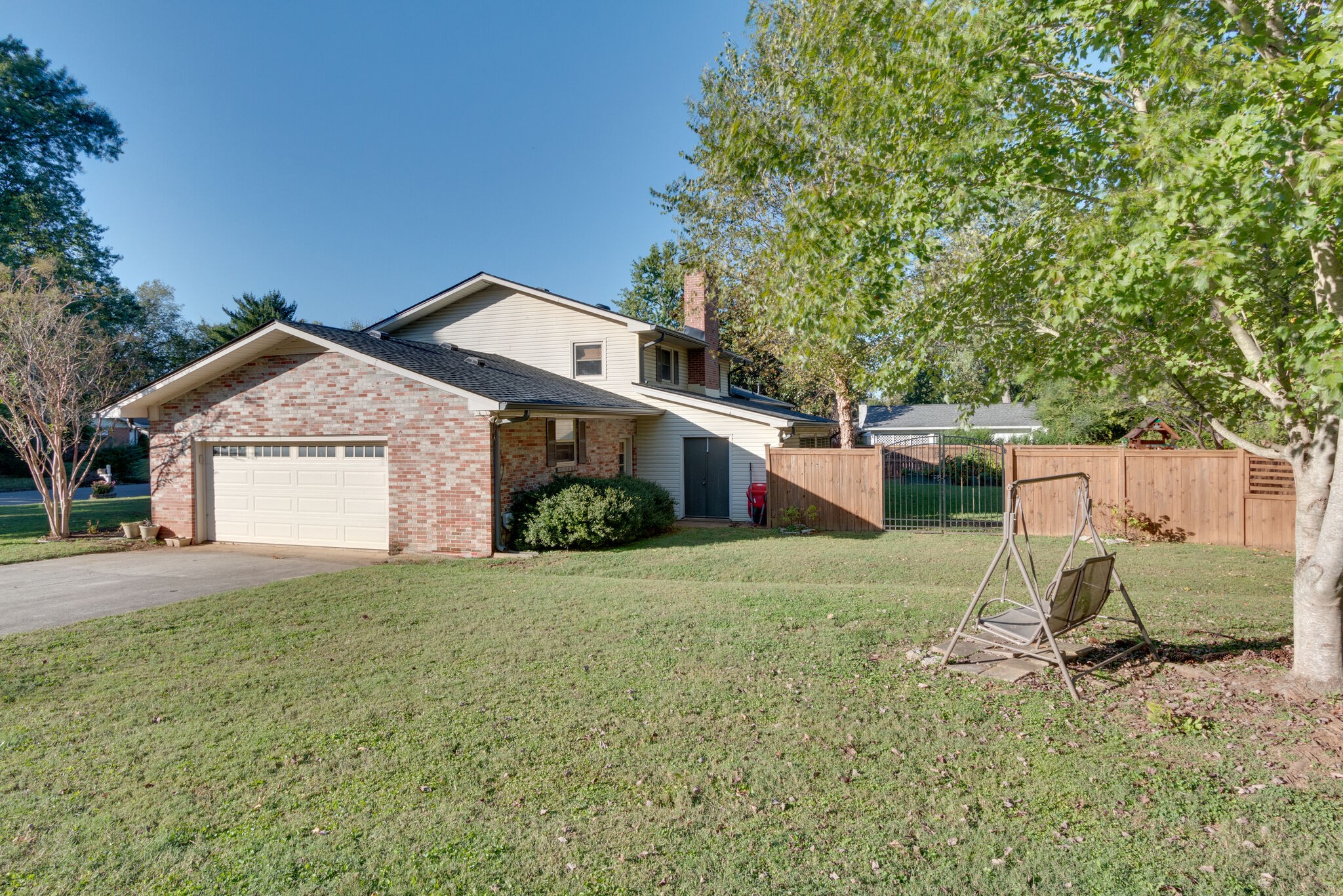 1202 Raleigh Court Murfreesboro, TN 37130 - Photo 30 of 34 a front view of a house with a garden and yard