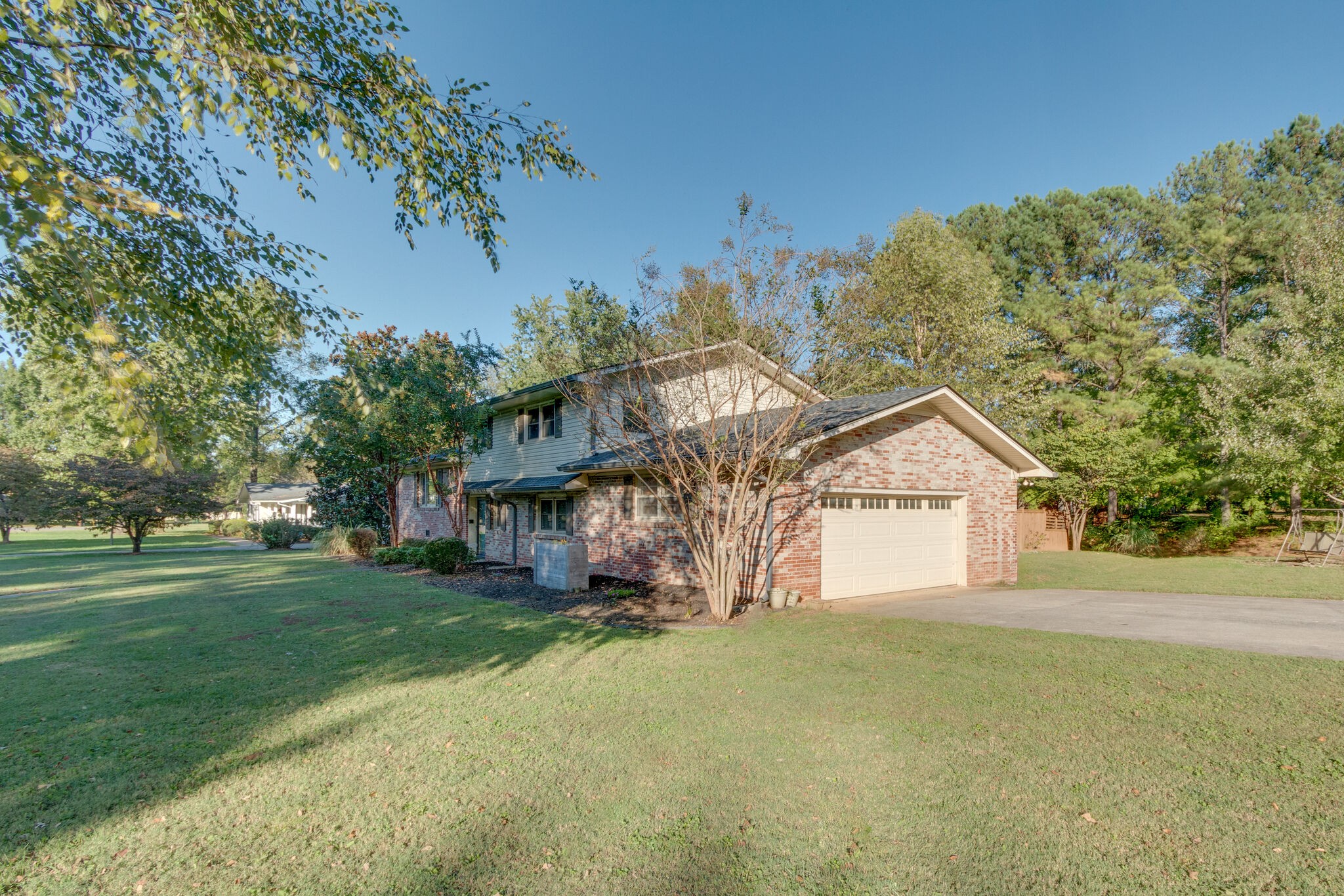 1202 Raleigh Court Murfreesboro, TN 37130 - Photo 3 of 34 a view of a big house with a big yard and large trees