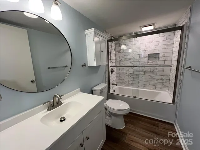 a room with wooden floor and utility room