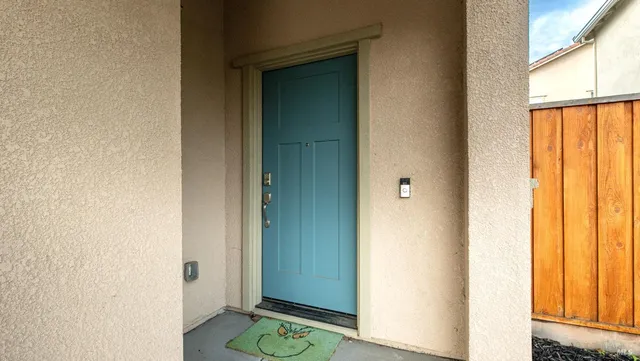 a patio with table and chairs
