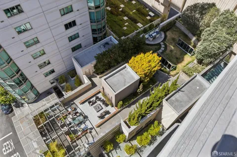 a swimming pool view with a outdoor seating space