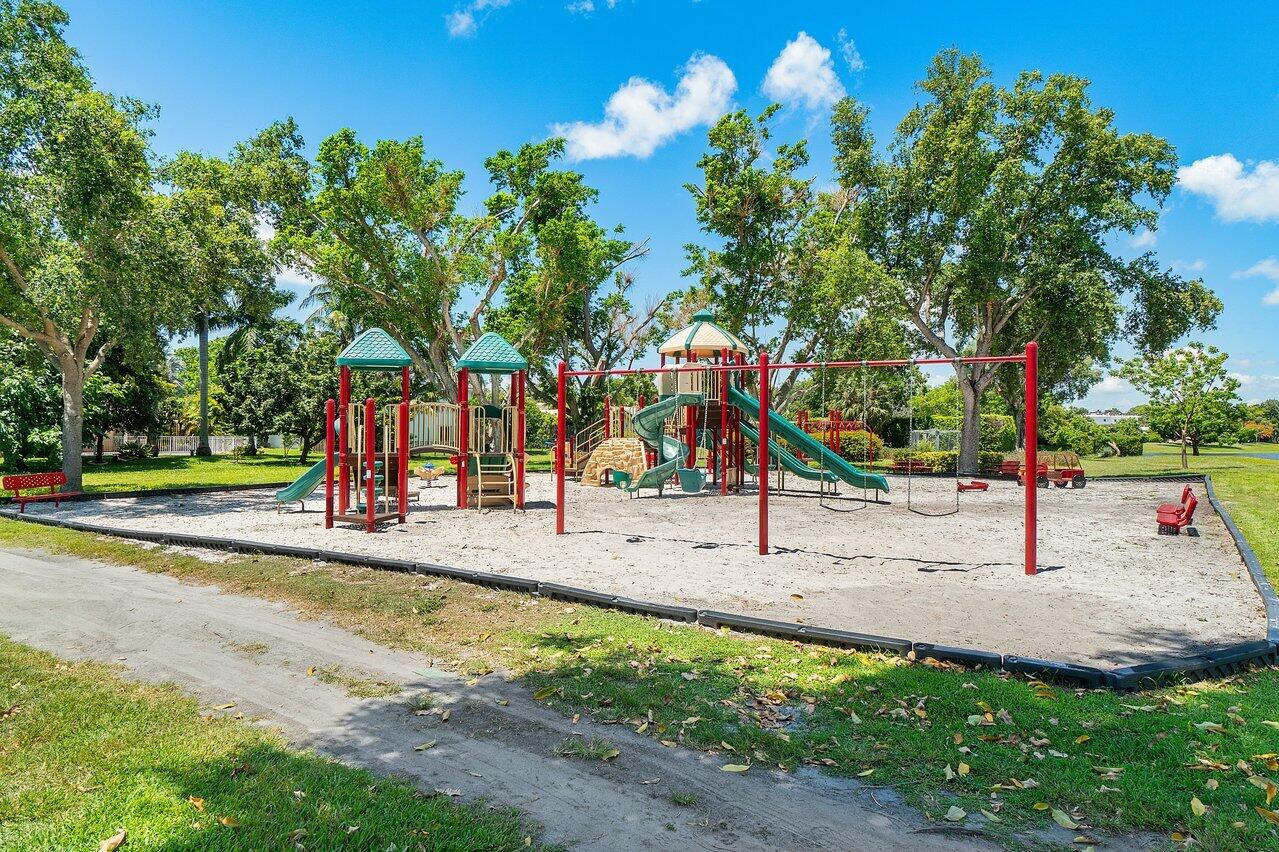2238 Northwest 30th Road Boca Raton, FL 33431 - Photo 25 of 27 a view of a park with swings and slides