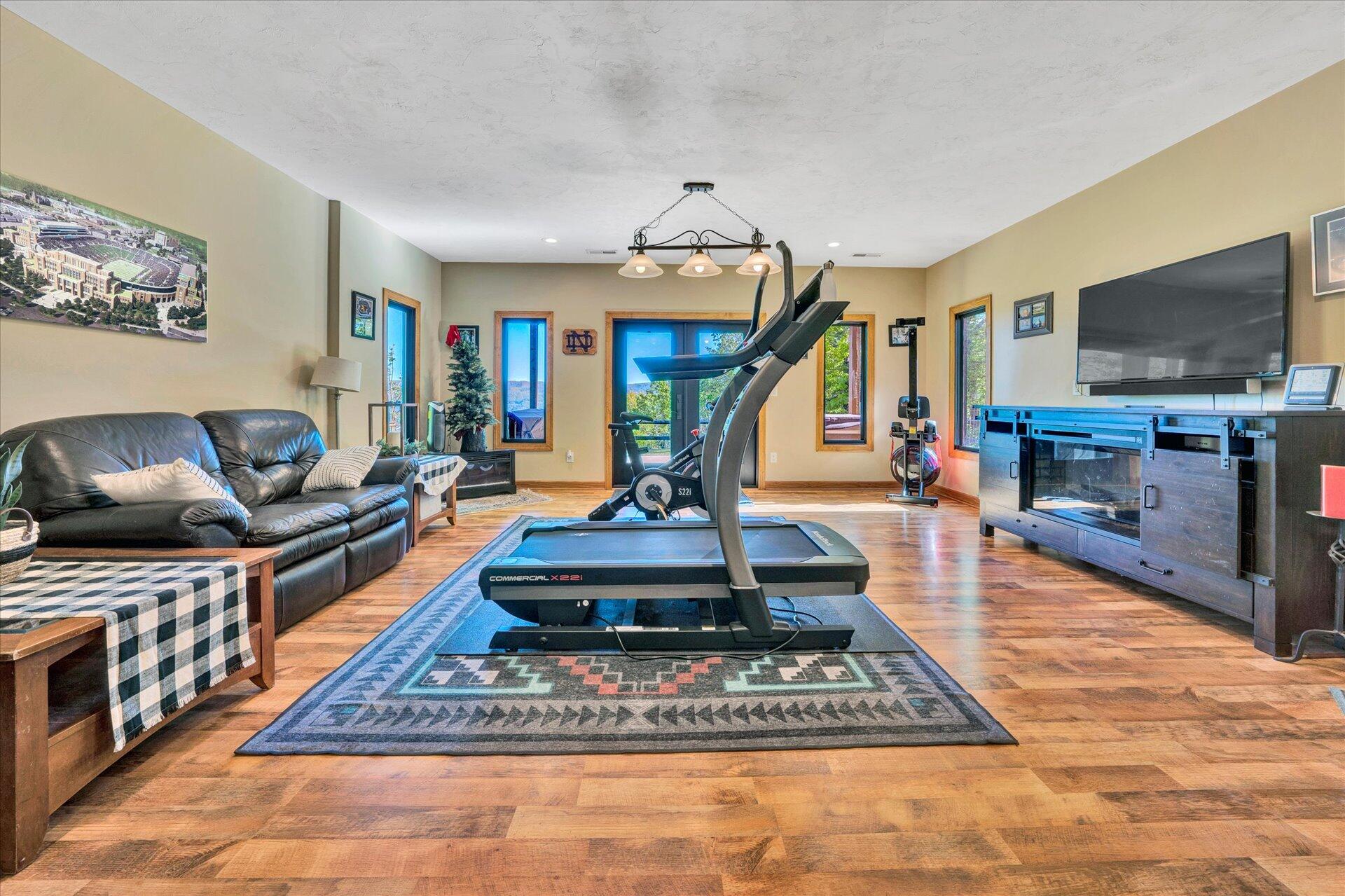 4939 Wade Road Roanoke, VA 24018 - Photo 9 of 57 a living room with furniture a flat screen tv and a rug