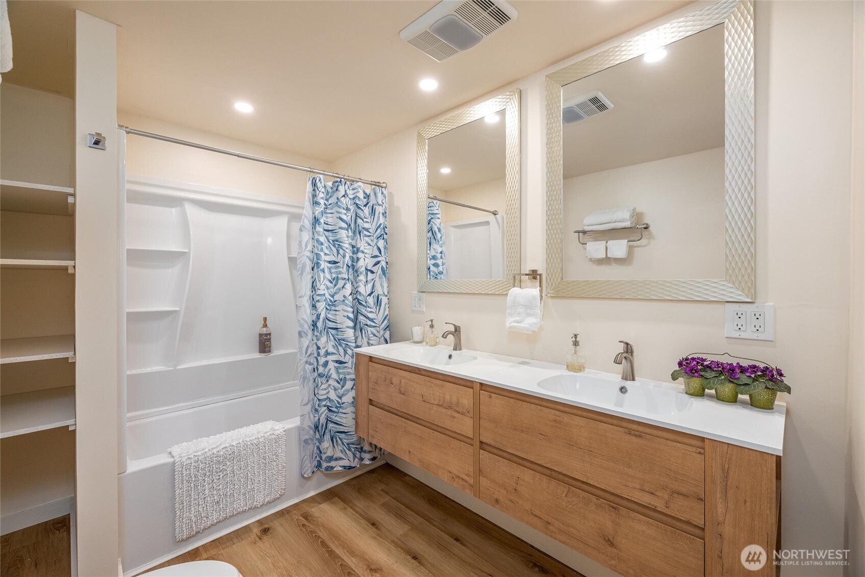 3456 Emma Road Bellingham, WA 98226 - Photo 14 of 32 a bathroom with a tub sink and mirror