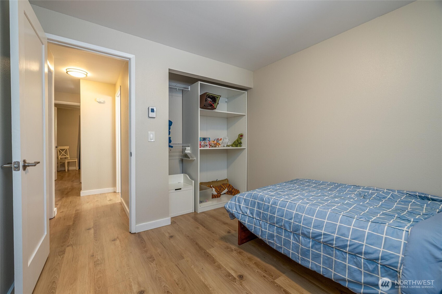 3456 Emma Road Bellingham, WA 98226 - Photo 21 of 32 a bedroom with a bed and wooden floor