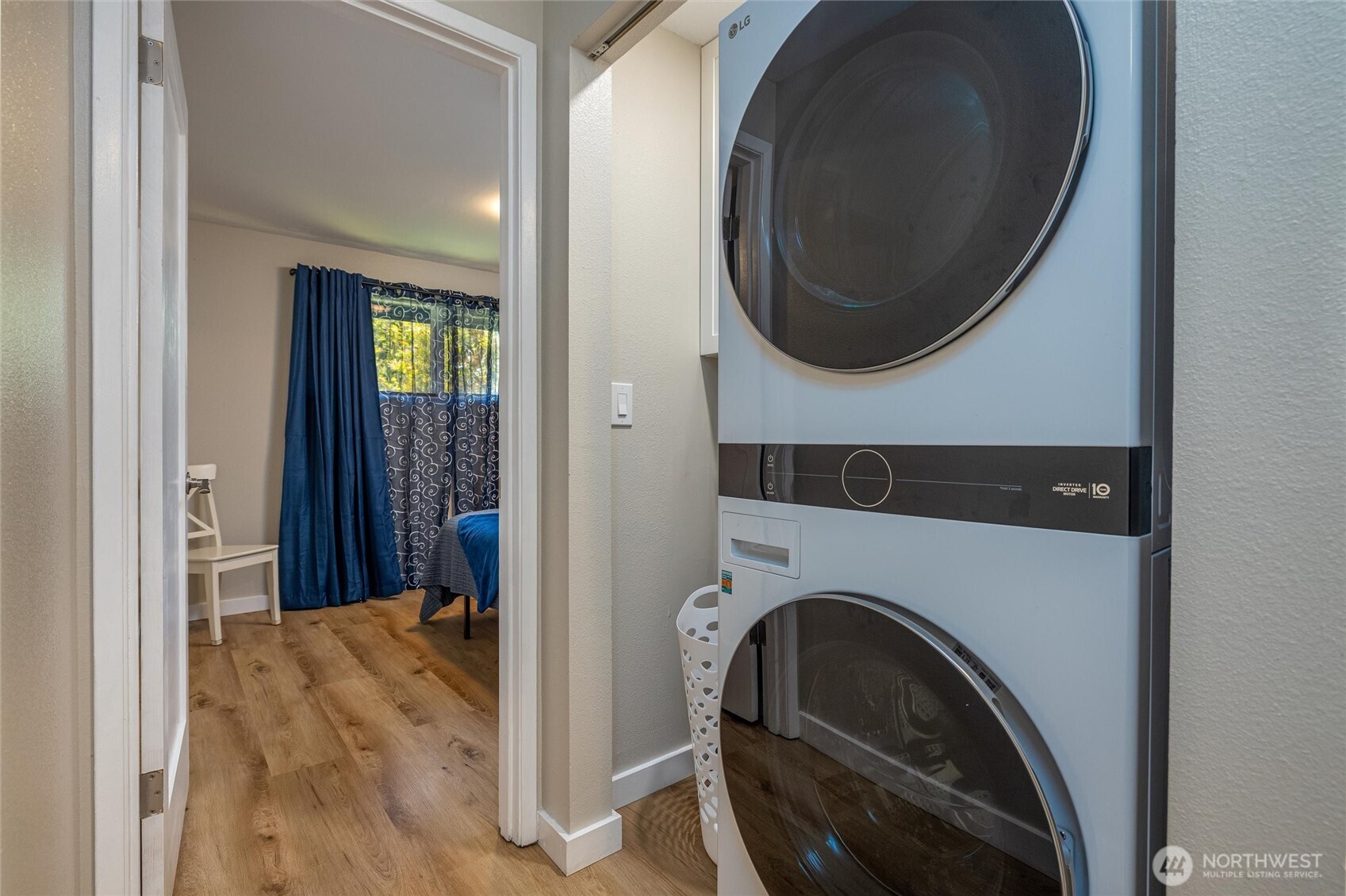 3456 Emma Road Bellingham, WA 98226 - Photo 26 of 32 a utility room with mirror and a washer dryer
