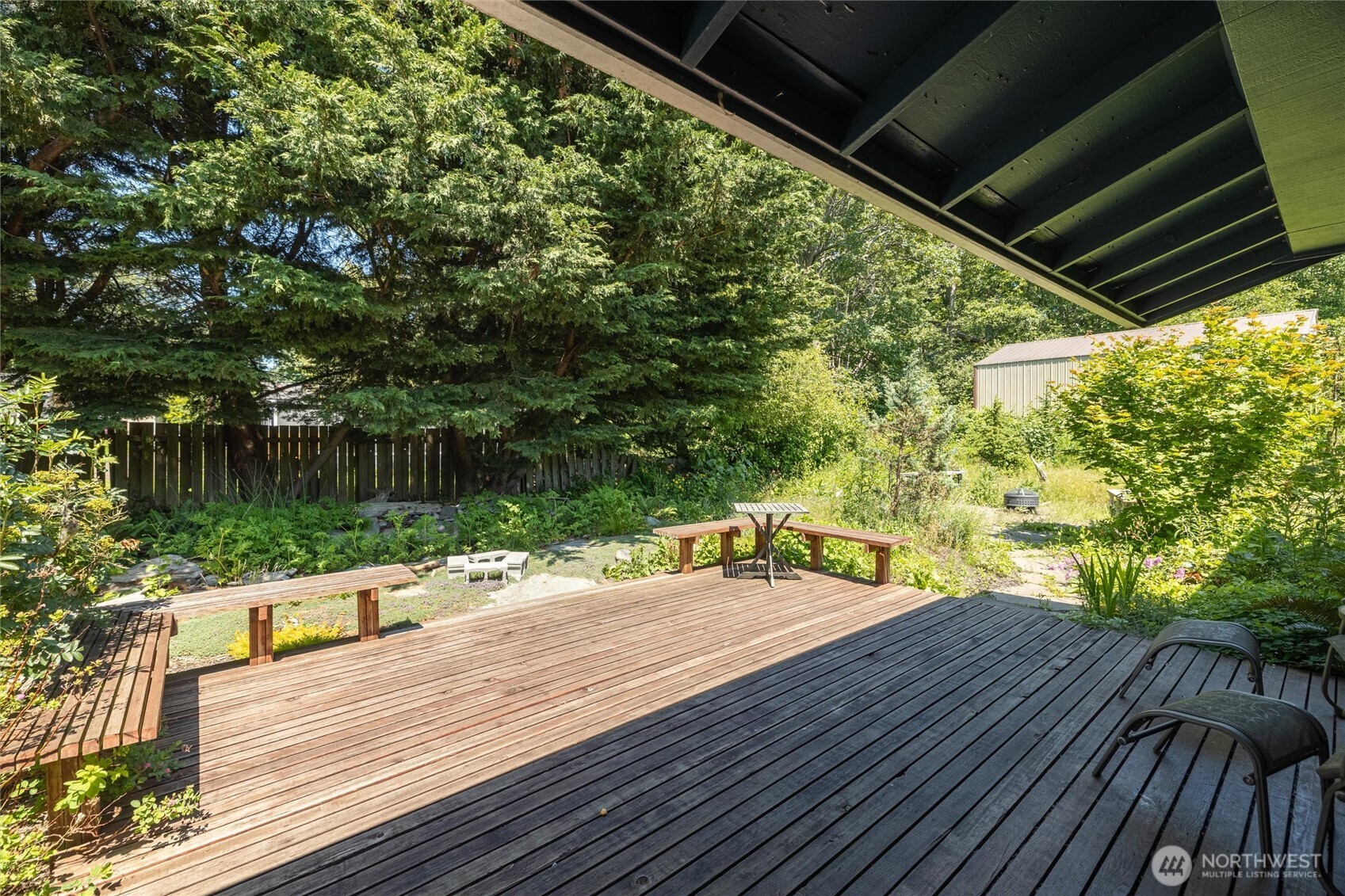 3456 Emma Road Bellingham, WA 98226 - Photo 27 of 32 a wooden deck with sunset view