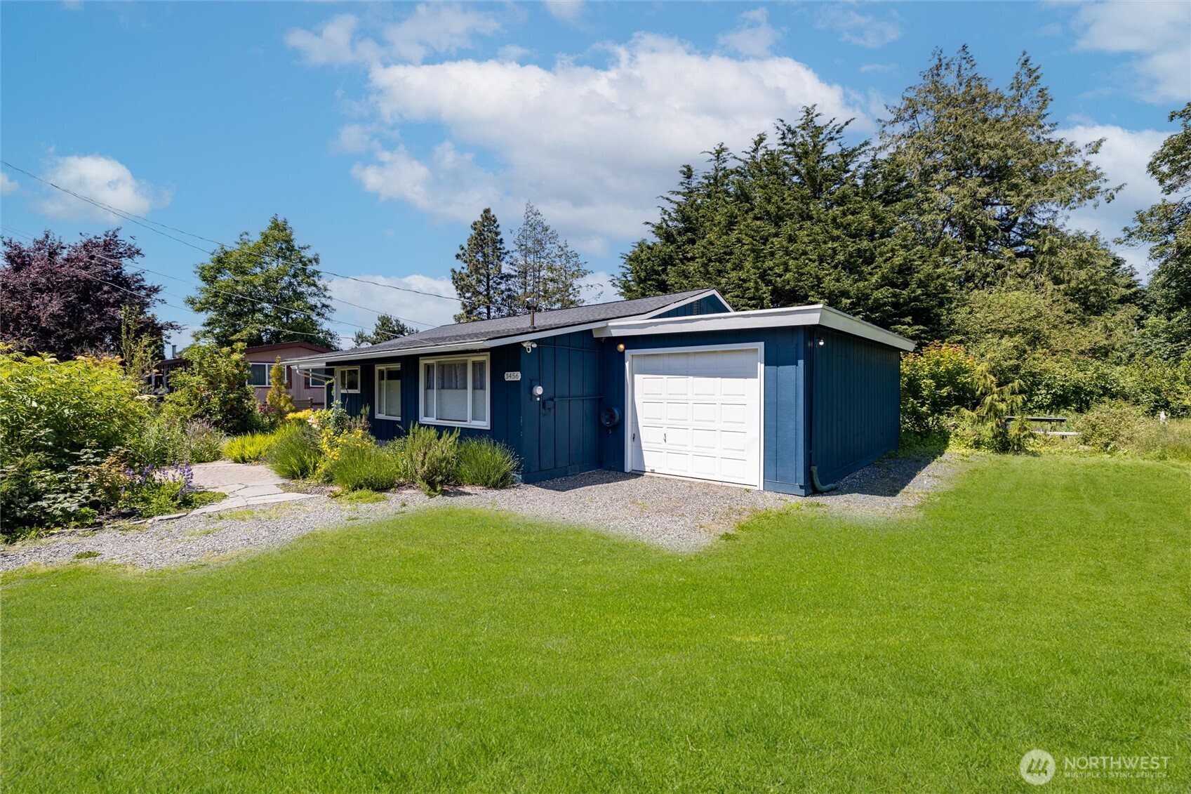 3456 Emma Road Bellingham, WA 98226 - Photo 31 of 32 a front view of a house with a yard and garage