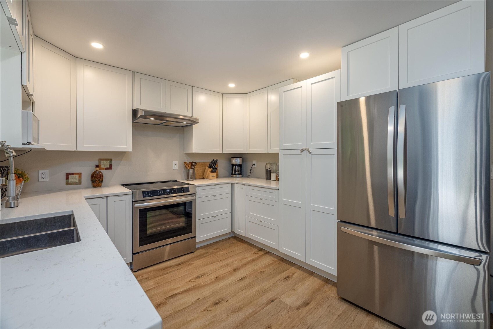 3456 Emma Road Bellingham, WA 98226 - Photo 7 of 32 a kitchen with stainless steel appliances a refrigerator sink and stove