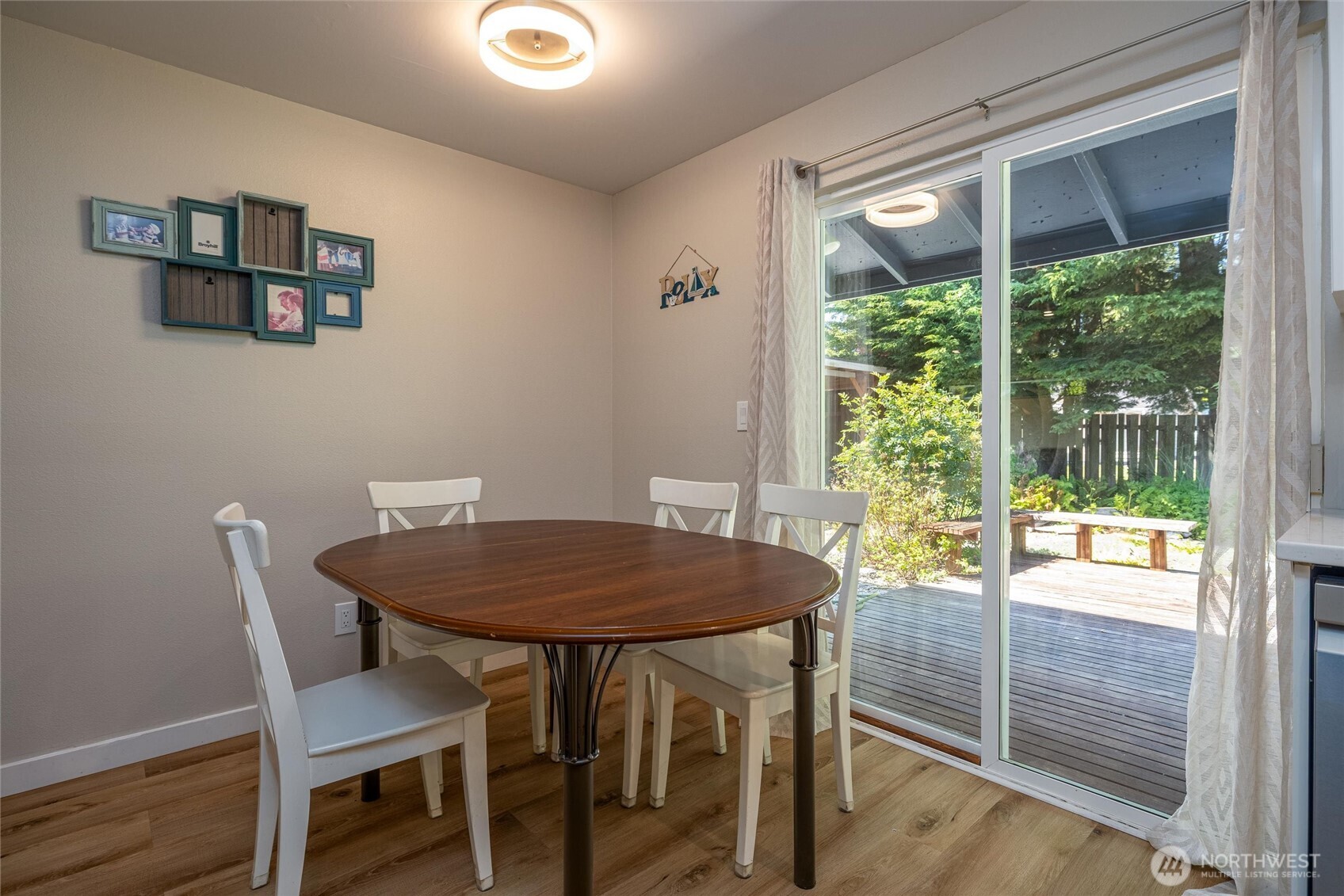 3456 Emma Road Bellingham, WA 98226 - Photo 9 of 32 a view of a dining room with furniture and wooden floor