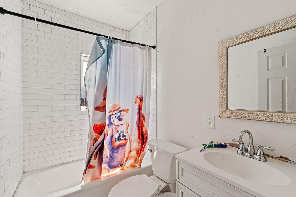 1205 Grand Avenue Santa Rosa, CA 95404 - Photo 19 of 27 a bathroom with a sink and toilet