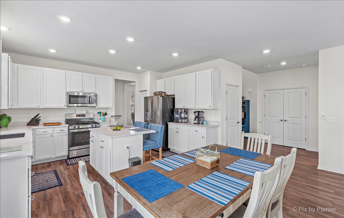 1315 Sage Circle Joliet, IL 60431 - Photo 11 of 27 a kitchen with white cabinets and stainless steel appliances