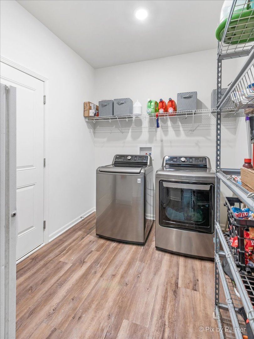 1315 Sage Circle Joliet, IL 60431 - Photo 14 of 27 a kitchen with granite countertop a stove and a wooden floors