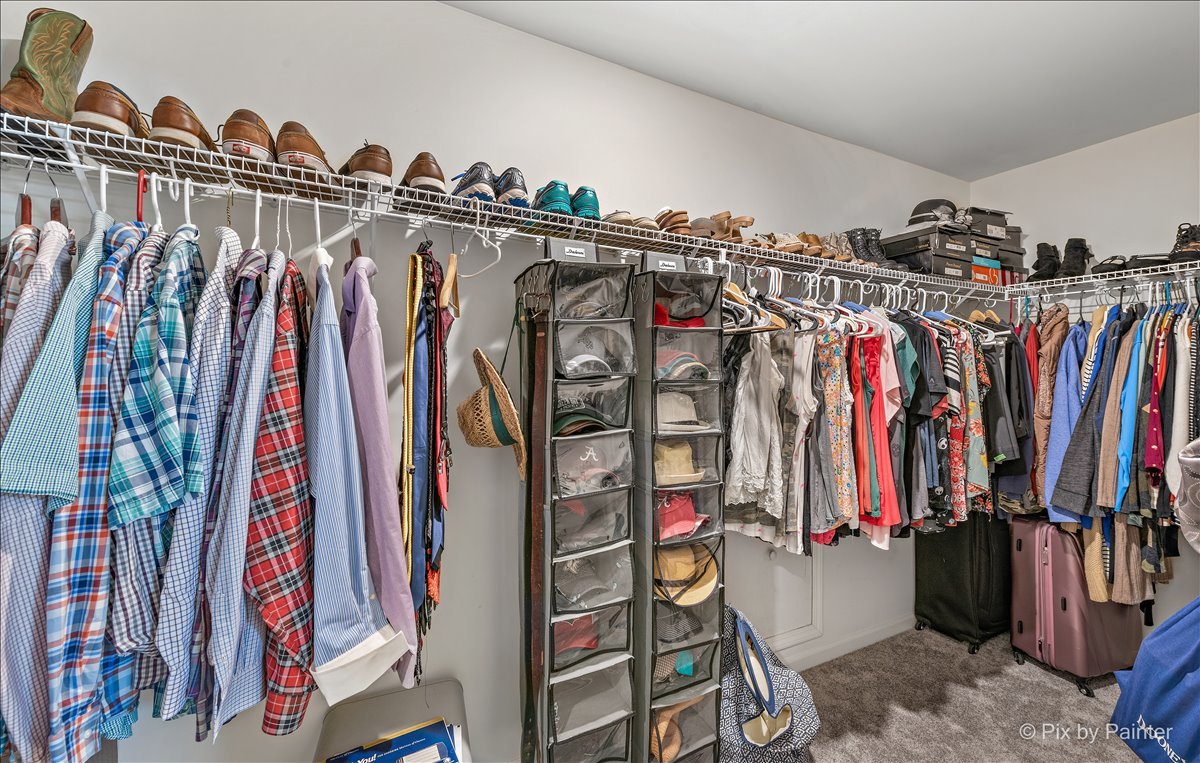 1315 Sage Circle Joliet, IL 60431 - Photo 20 of 27 a view of walk in closet with clothes