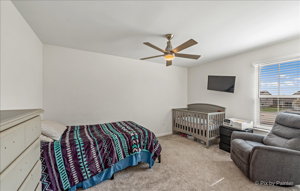 1315 Sage Circle Joliet, IL 60431 - Photo 22 of 27 a bedroom with furniture and a window