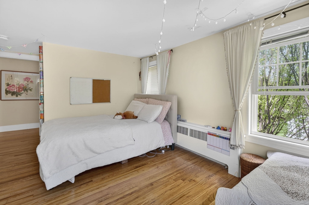 229 Parkerville Road Southborough, MA 01772 - Photo 12 of 38 a bedroom with a bed and a large window