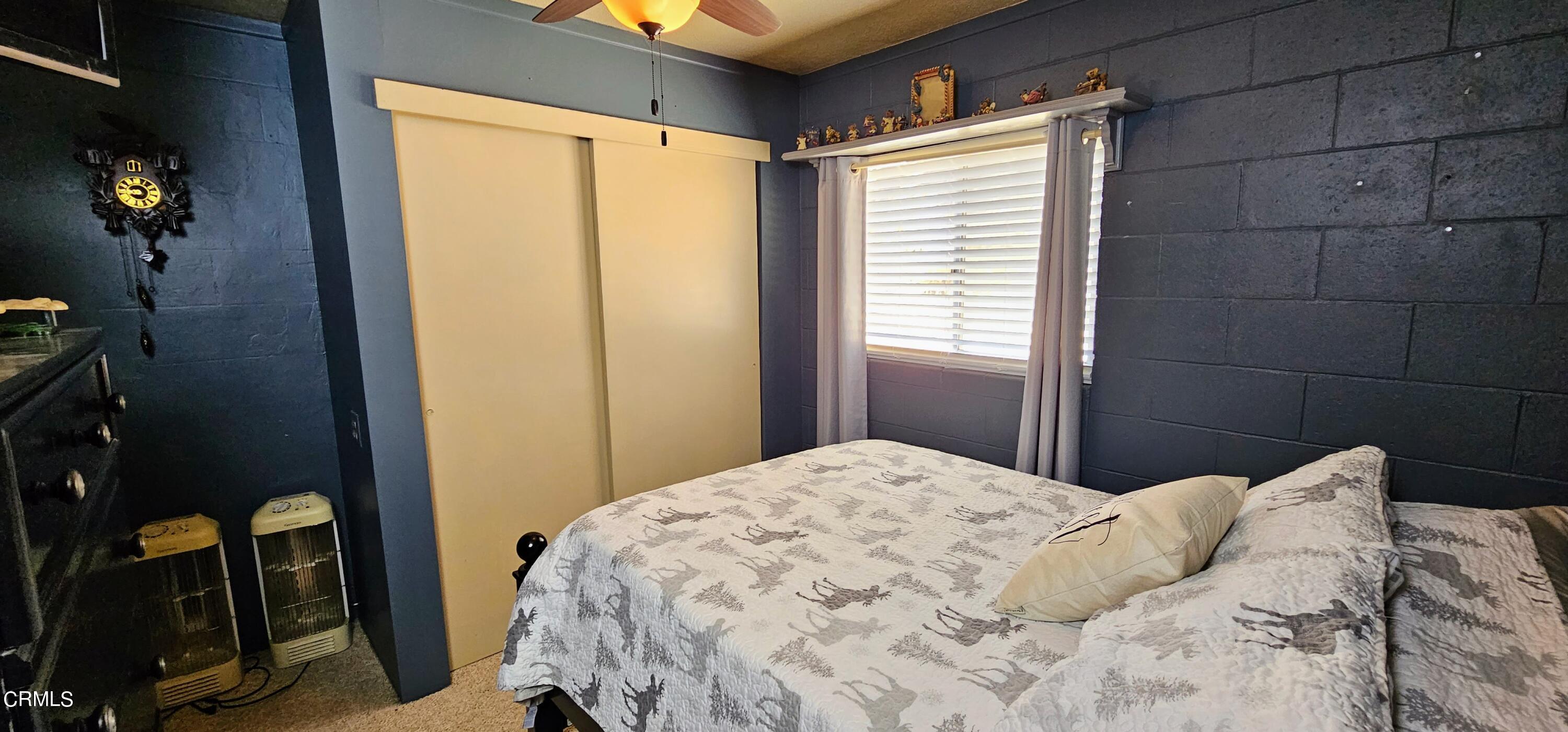 1157 Eugene Maricopa Ca Maricopa, CA 93252 - Photo 11 of 28 a bedroom with a bed and a window