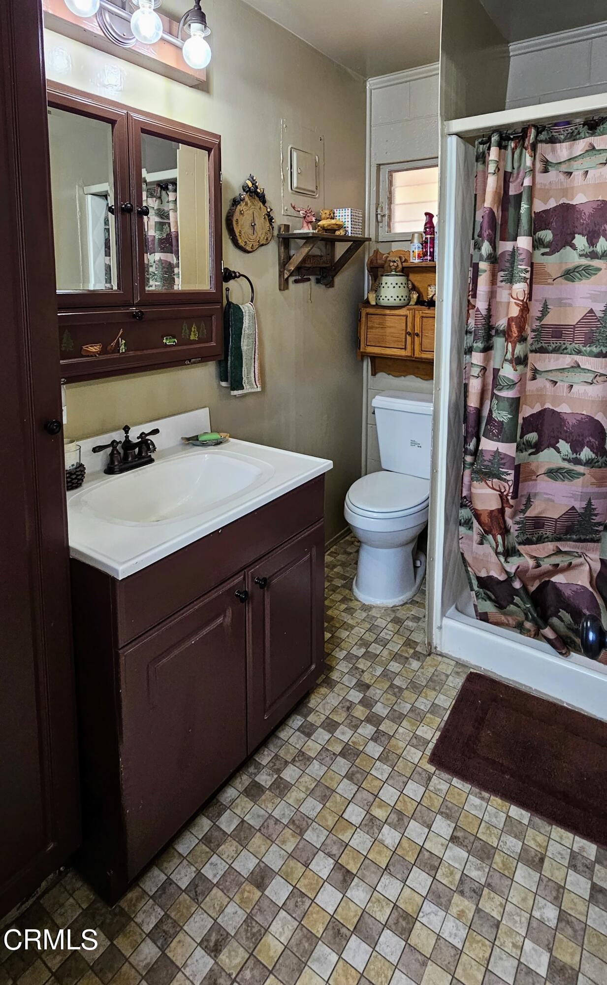 1157 Eugene Maricopa Ca Maricopa, CA 93252 - Photo 10 of 28 a bathroom with a sink toilet and shower