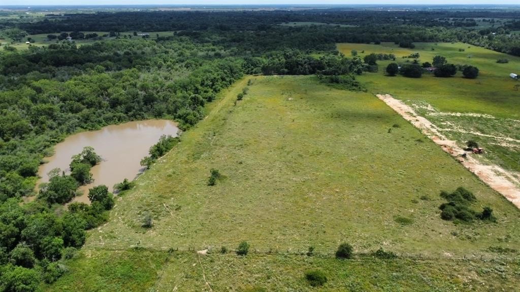 1966 Hluchan Road Sealy, TX 77474 - Photo 4 of 16 a view of a lake with a yard