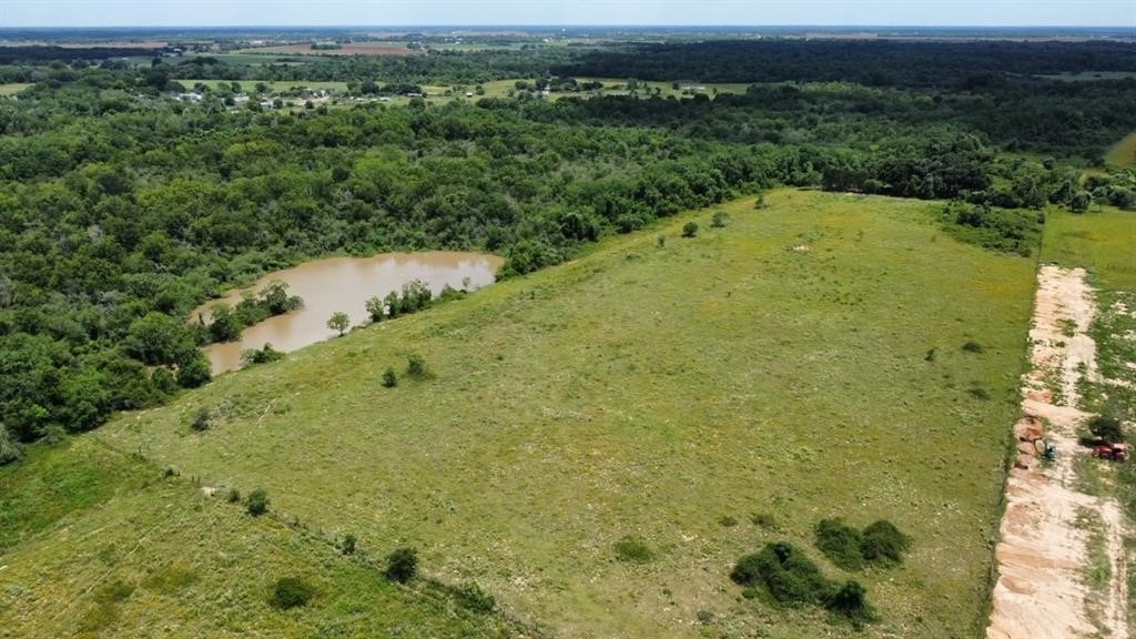 1966 Hluchan Road Sealy, TX 77474 - Photo 6 of 16 a view of a yard with a lake view